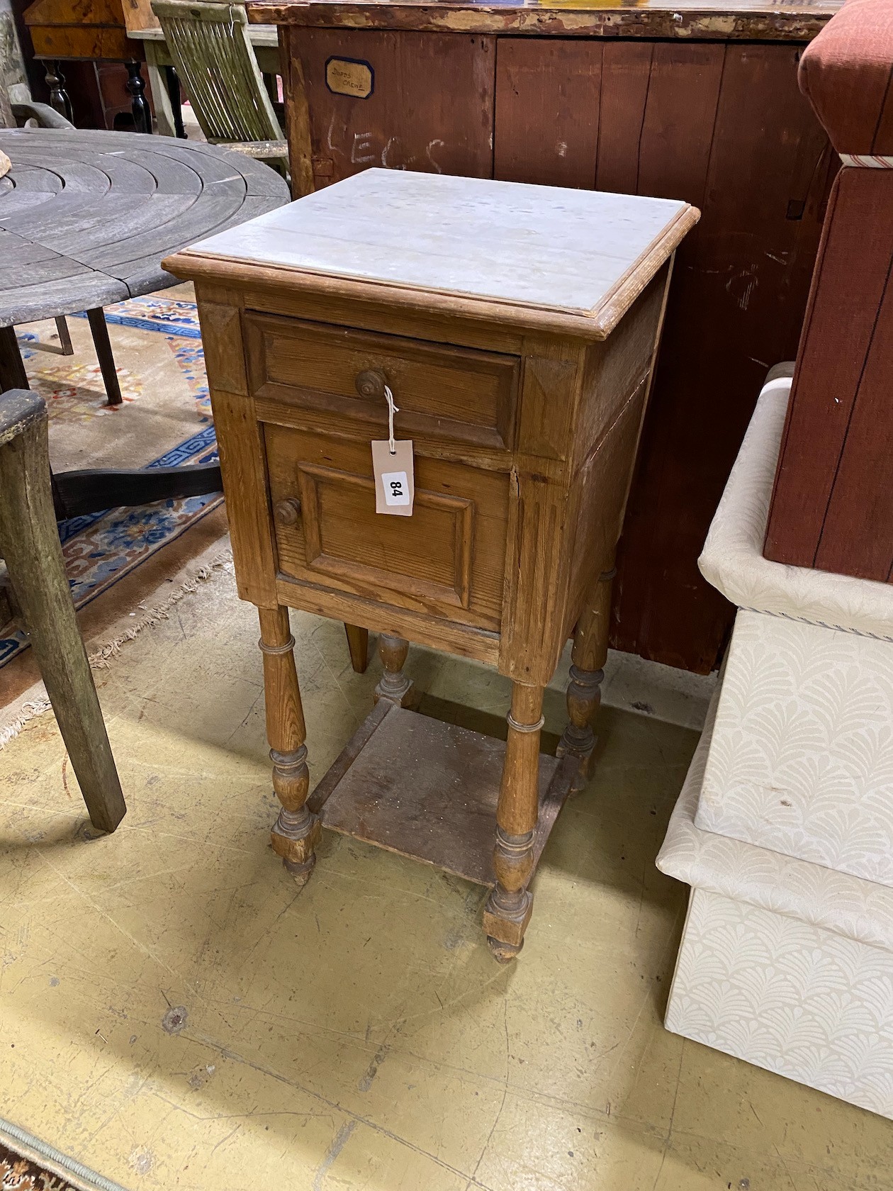 A late 19th century French pine marble topped two tier bedside cabinet, width 38cm, depth 38cm, height 88cm